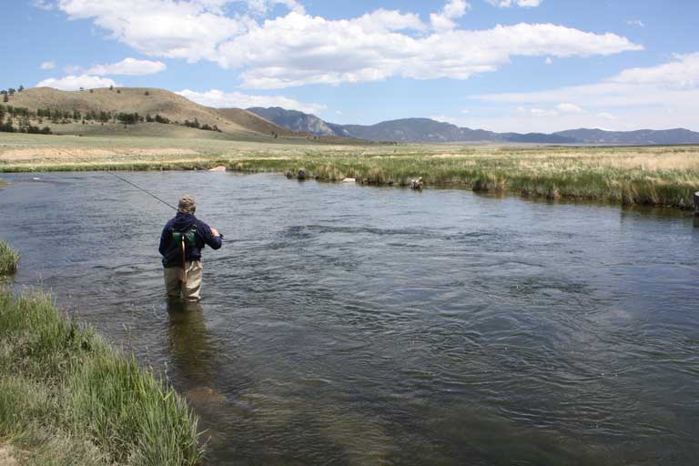 Recreation at proposed Wild Horse Reservoir Project with fisherman fishing in the river.